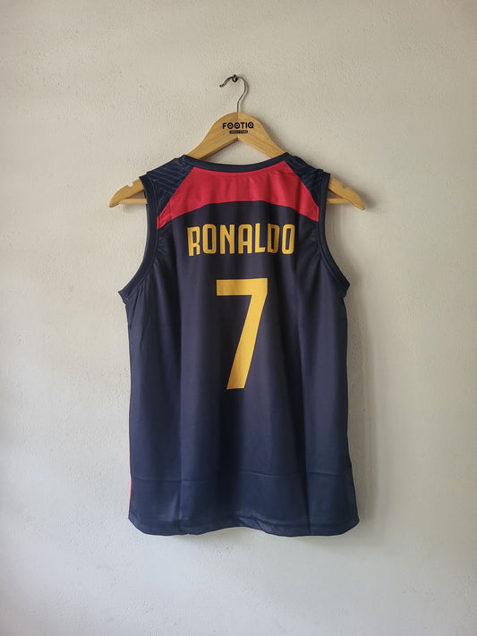 A navy blue soccer jersey with 'RONALDO' and the number '7' in yellow on the back, hanging on a wooden hanger against a plain beige wall.