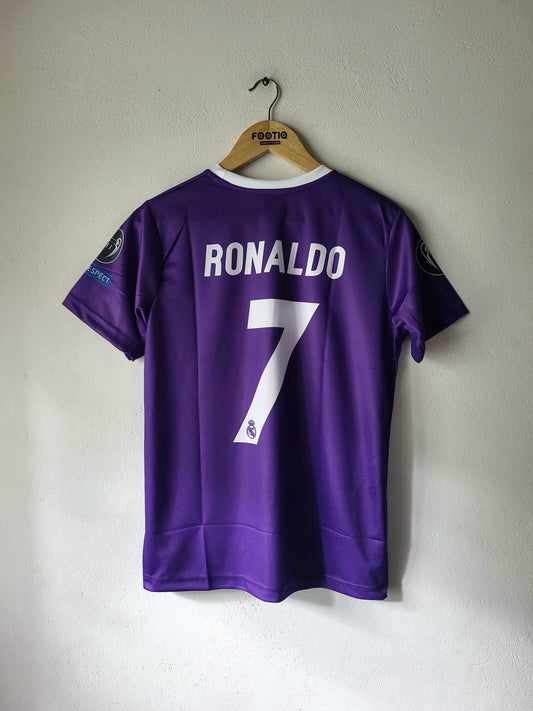 A purple short-sleeve soccer jersey with 'RONALDO' and the number '7' printed in white on the back, hanging on a wooden hanger against a light gray wall.