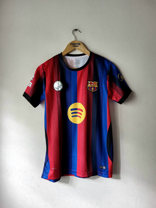 A vintage FC Barcelona home soccer jersey with red and blue vertical stripes, featuring the yellow Spotify sponsor logo on the front, hanging on a wooden hanger against a plain wall.