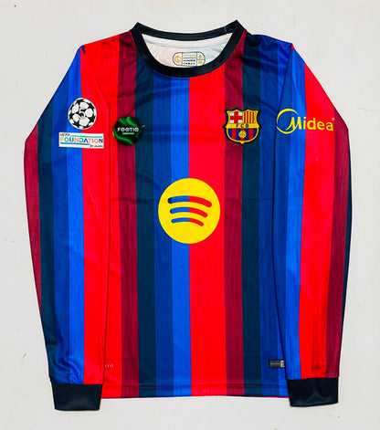 A long-sleeve FC Barcelona soccer jersey with red and blue vertical stripes, featuring the club crest, Midea logo, and Spotify sponsor logo on the front.