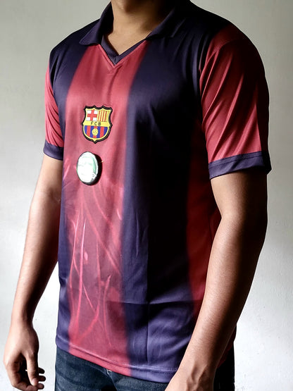 A person wearing a vintage-style FC Barcelona soccer jersey with vertical red and navy stripes, featuring the club crest on the chest and a round badge patch.