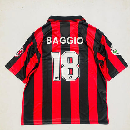 Black and red striped sports jersey with 'BAGGIO' and number '18' on a light gray background