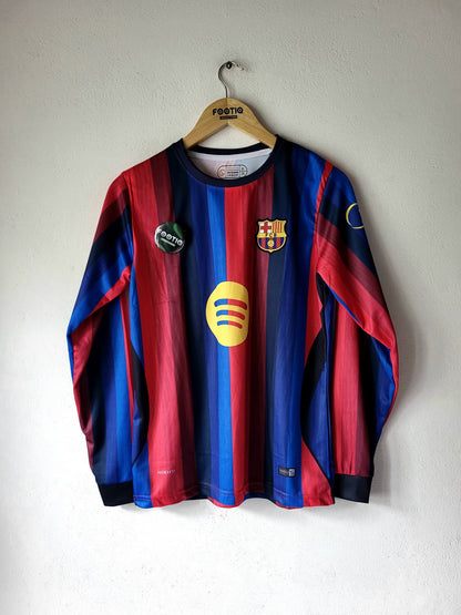 A vintage FC Barcelona long-sleeve soccer jersey with red and blue stripes, hanging on a wooden hanger against a white wall. The jersey features the club's crest on the chest, a yellow sponsor logo, and a circular 'POSTE' badge on the left chest.