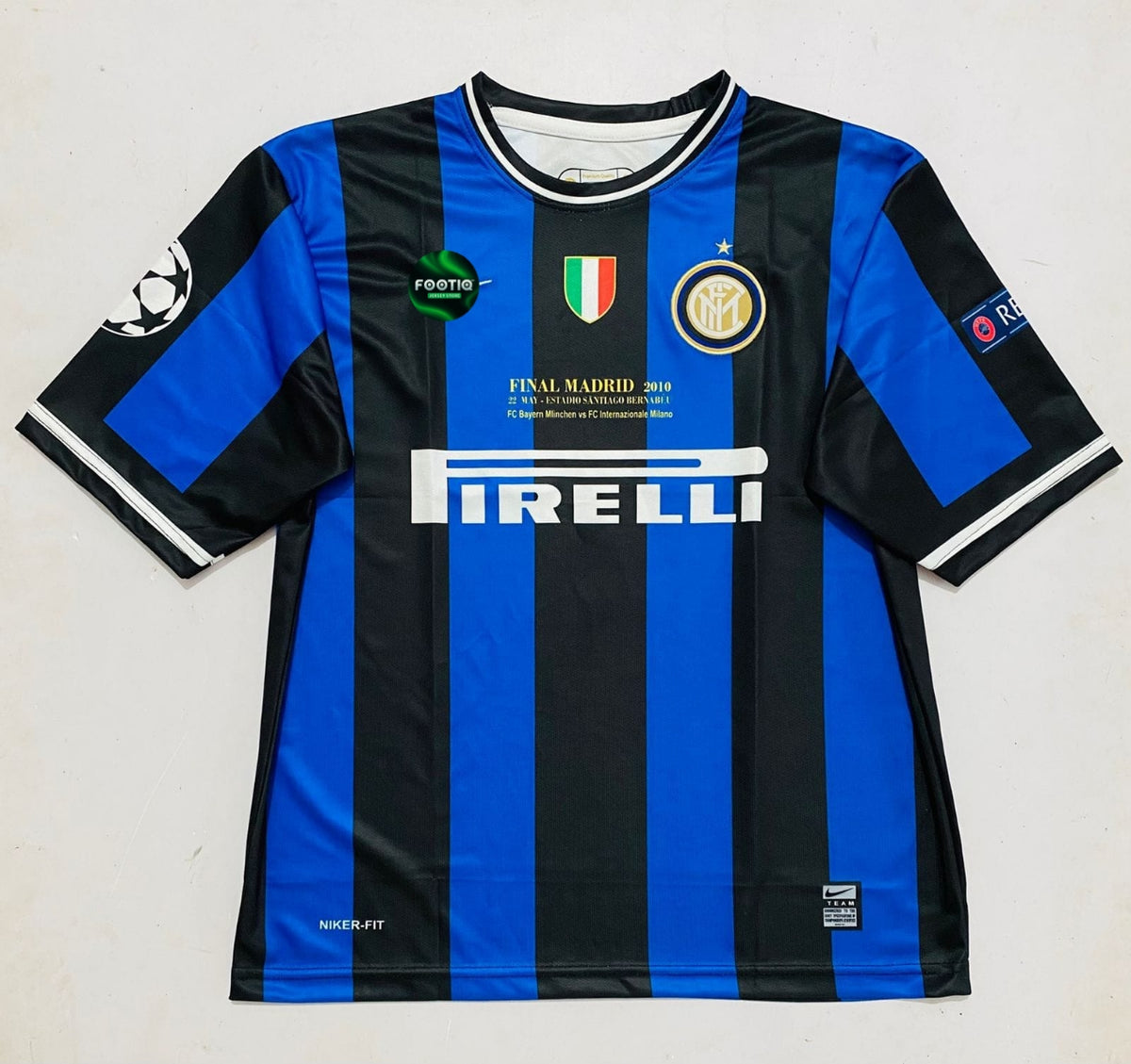 A vintage Inter Milan soccer jersey with blue and black vertical stripes, featuring the Pirelli sponsor logo on the front, the club crest, and a Final Madrid 2010 patch.